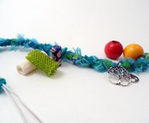 Girl with Beads and Sleeves in her Dreadlocks